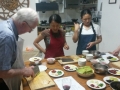 Brendan Halligan, on a visit to China, 2014, participate in a lesson in Chinese cookery.